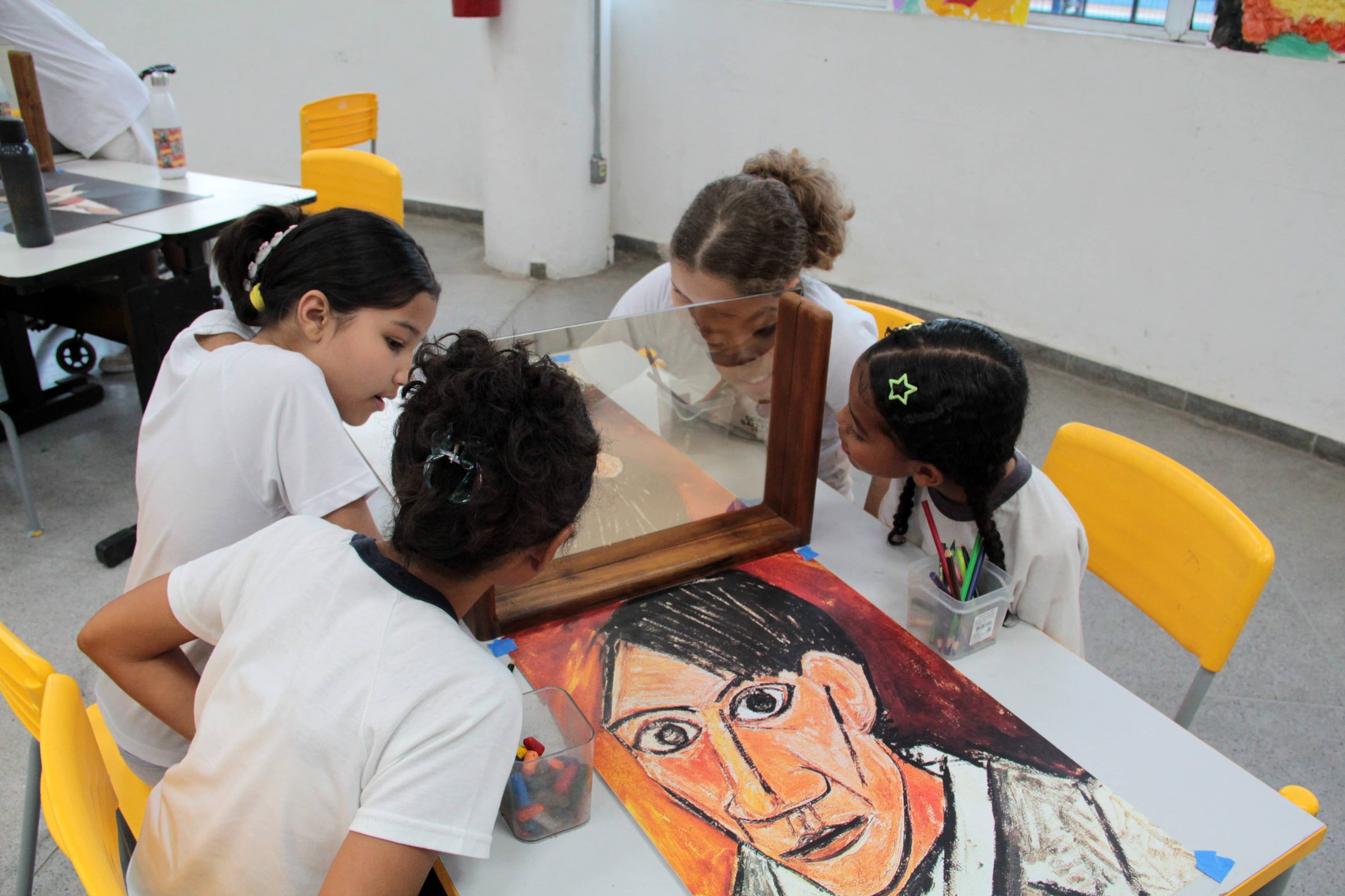 Students creating a reinterpretation of Picasso