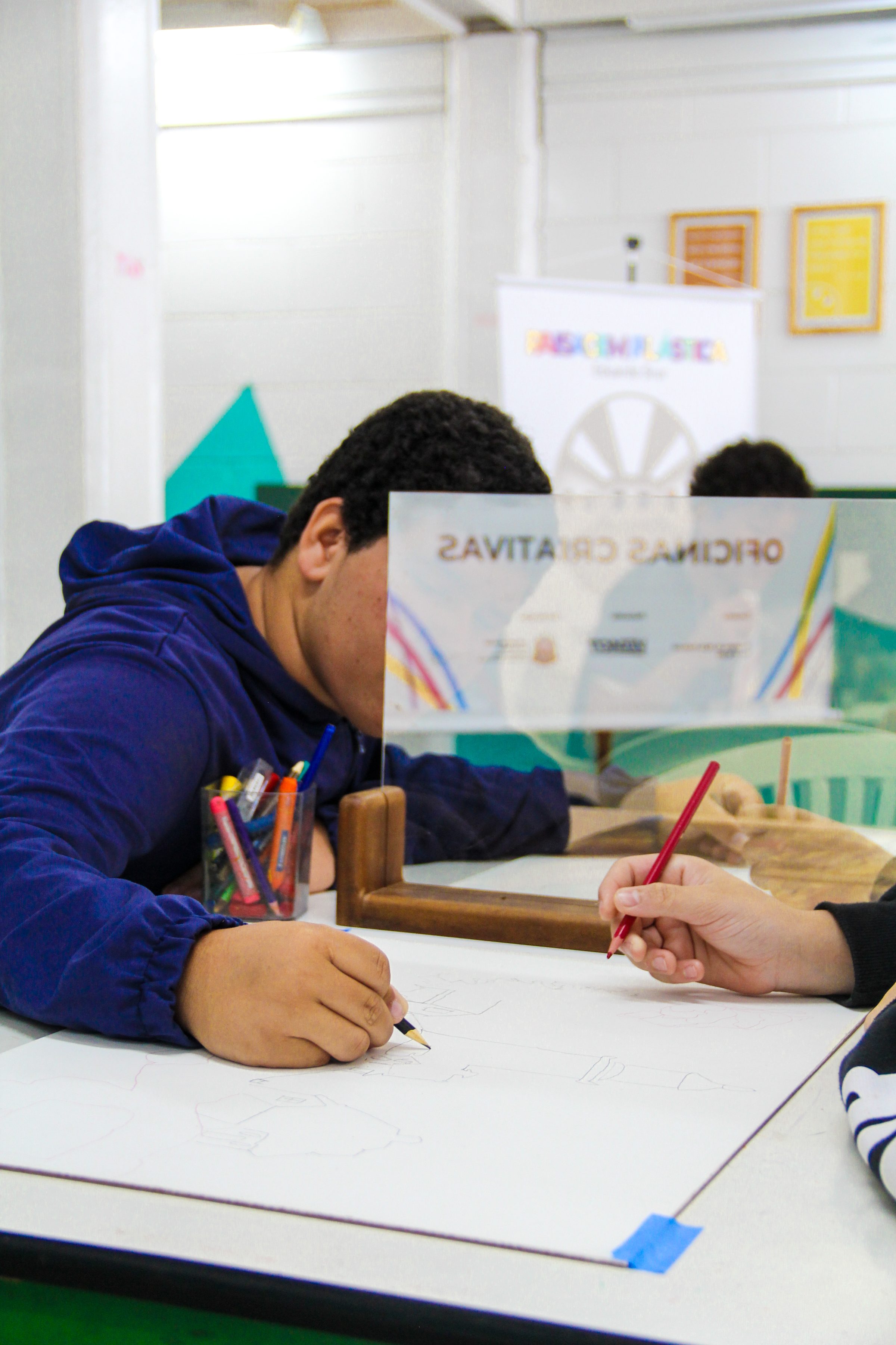 Student drawing a reinterpretation of a landscape